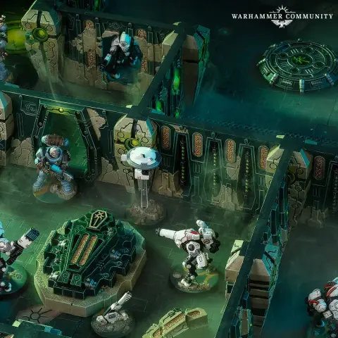 A detailed tabletop scene showcases a Kill Team game setup featuring miniatures from the Space Wolves and Tau factions. In the foreground, a Space Wolf in blue armor stands beside a green, ornate tomb-like structure, while two Tau in XV26 battlesuits are positioned nearby, ready for action. The backdrop includes intricately designed walls with glowing green accents and a hovering drone, creating a sci-fi atmosphere within a Tomb World killzone.