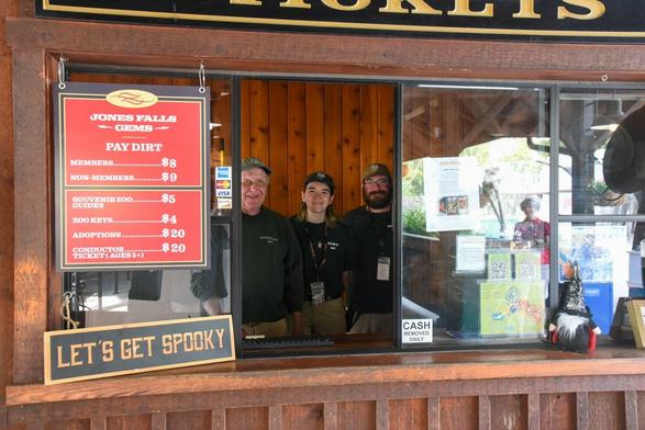 Description Provided by @marylandzoo: 
Guest services staff behind a ticket window