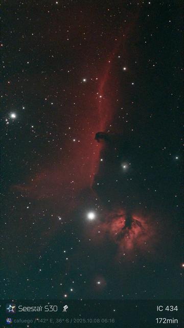 A softly glowing red cloud of gas behind the dark sharp edge of a foreground dust cloud. Part of the dust looks like the silhouette of a horses head. 

Below it sit an orange nebula shaped a bit like a
flame or upside down drop, with a bright star next to it.

Seestar S30
cafuego / 142° E, 36° S / 2025.10.08 06:16
IC 434
172min