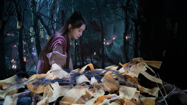 In the Demon-Slaughtering Cave, Wen Qing sits next to Wen Ning, who is lying down and covered with countless talismans.