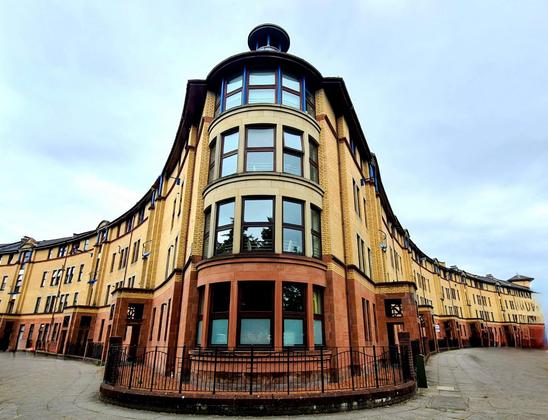 A modern tenement building with features based on older, traditional Glasgow tenements.