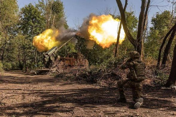 Ukrainian soldiers fire the Ukrainian artillery piece 'Bohdana' from their artillery position in the direction of Toretsk, Ukraine, summer 2025