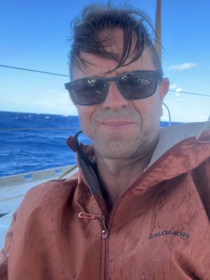 Leigh Evans seated on the deck of the flotilla yacht during preparations for the Gaza aid mission.