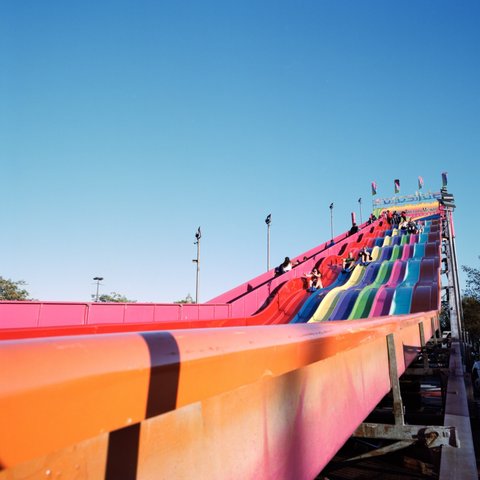 The view from the side, looking up, of The Euroslide, a rainbow of slide courses.