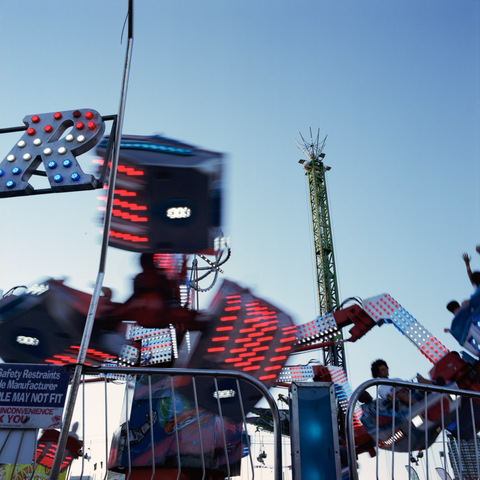 A spinning ride becomes an abstraction of lights and forms.