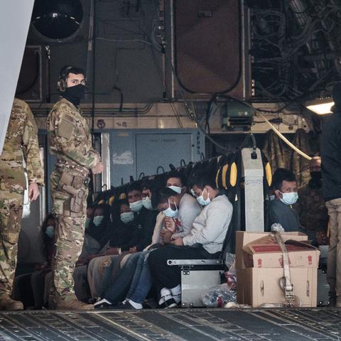 About 80 people being deported to Guatemala sit aboard a U.S. Air Force plane in January awaiting departure from Fort Bliss, Texas.
