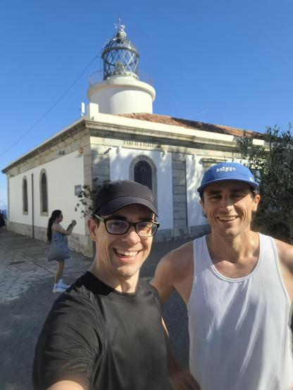 Me and Simon with lighthouse in Palafrugell in the background