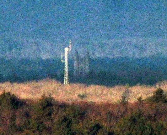 Galen Stone Tower, Green Hall, Wellesley College, 106 Central St, Wellesley MA photographed from Buck Hill. A white communications tower is just to the left.