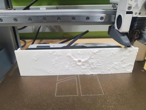 3d printer at the start of making the crater model.