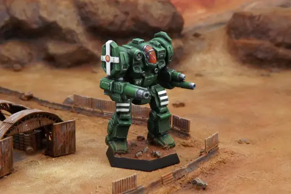 A painted miniature of a Templar 'Mech.  It is green with white stripe highlights on the legs and shoulders.  The cockpit glass is red.  The sunburst emblem of the Federated Suns is on the right shoulder.  The number "07" is on the right torso.  The miniature is photographed on desert terrain.