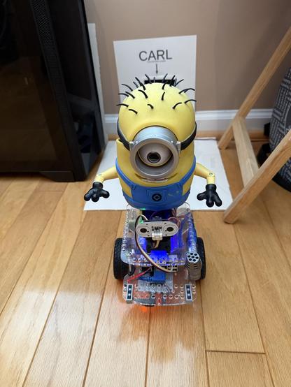 Minion Carl atop a GoPiGo3 robot platform.
