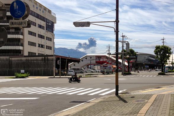 Mt. Sakurajima volcano doing its thing, as seen from downtown Kagoshima, Japan.