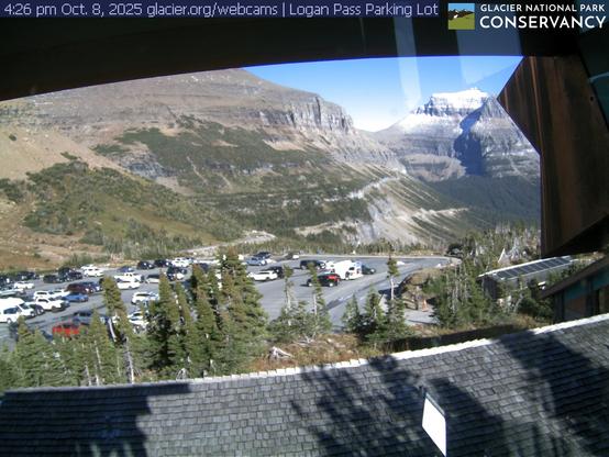 Located at the highest point along the Going-to-the-Sun Road, the Logan Pass area includes the Logan Pass Visitor Center, trailheads for the Highline and Hidden Lake trails, restrooms, potable water, and shuttle service. This view focuses on the Logan Pass parking lot with Mt. Pollock and Going-to-the-Sun Mountain in the background.

This webcam is brought to you through a partnership with the Glacier National Park Conservancy. Want to see all three Logan Pass webcams at the same time? Head to the Conservancy's website at the link below.