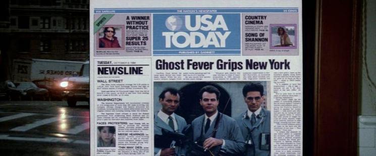 A newspaper, the USA today, dated October 8, 1984. The headline reads, "Ghost Fever Grips New York"