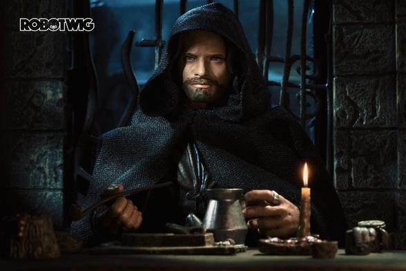 Aragorn sits in the Prancing Pony lit by candlelight, smoking a pipe and drinking beer