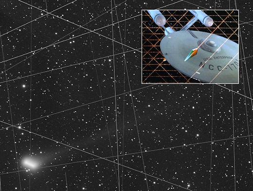 Image showing the night sky filled with stars and a comet to the lower left. Crisscrossing the view are many white lines caused by StarLink satellites. In the upper right of the image is a picture of the star ship Enterprise (NCC-1701) being trapped in similar crisscrossed lines from the episode The Tholian Web.