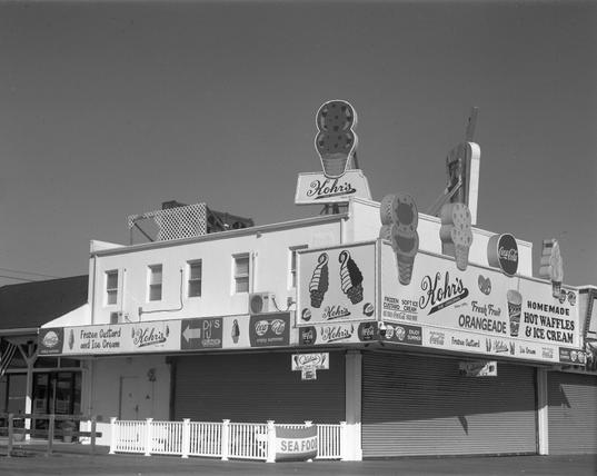 This place is a typographic nightmare. A sign on the roof says “Kohr’s The Original Since 1919” attached to a two scoop ice cream cone. The face of the building facing the boardwalk says the following: “Coca Cola enjoy summer Frozen Custard and Ice Cream Kohr’s The Original Since 1919 P J’s Place Seaside Heights NJ Coca Cola enjoy summer Kohr’s The Original Since 1919 Kohr’s The Original Since 1919 Coca Cola Coca Cola.” The side of the building is similarly festooned, but you really don’t want me to write all that crap down here.
