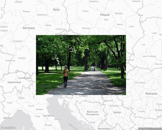 A photo of or from a park from the linked website, overlaid on a cropped world map where it's located.