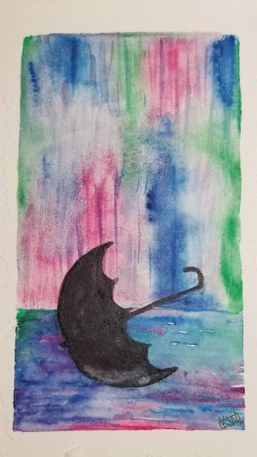 Black umbrella lies open on the wet ground on a day so rainy everything around it is reduced to blurry blues, greens, & pinks.