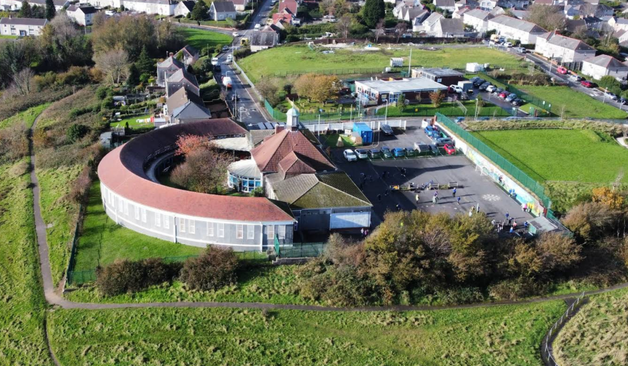 Drone photograph showing Sea View Community Primary School and surrounding Mayhill neighbourhood in Swansea, Wales.