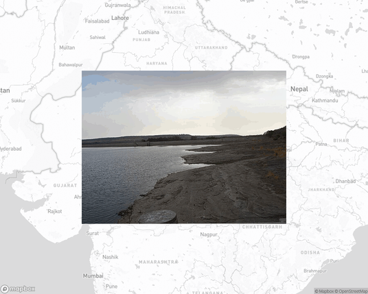 A photo of or from a national park from the linked website, overlaid on a cropped world map where it's located.