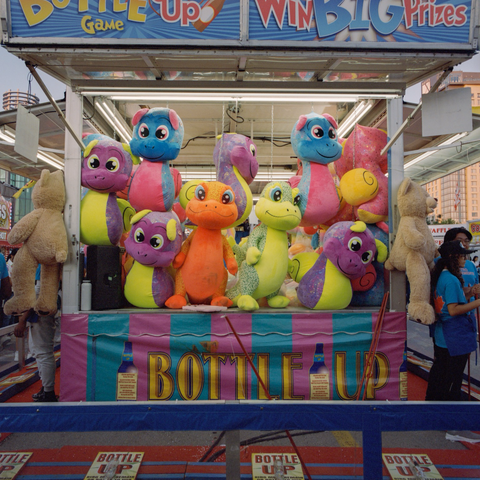 A veritable gang of colourful monster stuffies crowded into the end of the Bottle Up game stand look intent on defending their turf.