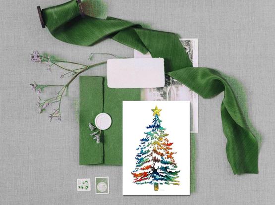 Colorful Christmas tree greeting card with green ribbons and envelope.