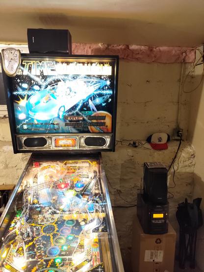 My Time Machine Pinball all lit up, accompanied by the mini hifi I just picked up for $10 on Craigslist