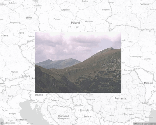 A photo of or from a national park from the linked website, overlaid on a cropped world map where it's located.