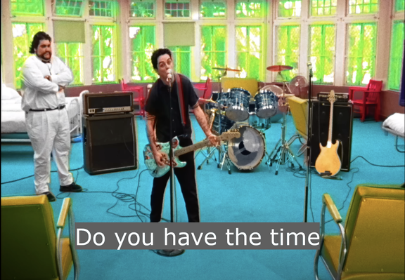still from green day's music video of basket case. the lead guitarist is singing into a mic and playing a guitar while looking at the camera. the caption reads "do you have the time". the joke is that the lyrics begin "do you have the time to listen to me whine". i couldn't find a still with suitable subtitles so i had to jankily make my own.