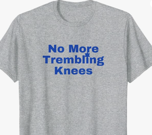 No More Trembling Knees is shown in blue lettering on a T shirt.