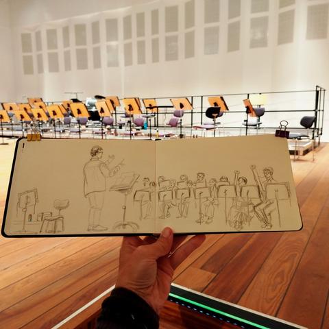 Sketchbook in front of the scenery.