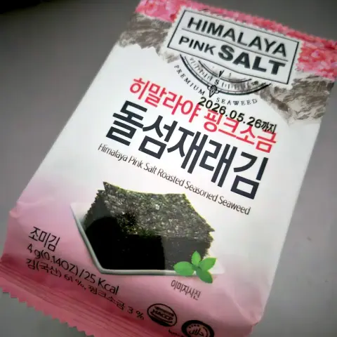 Plastic packet containing a snack of salted roasted seasoned seaweed