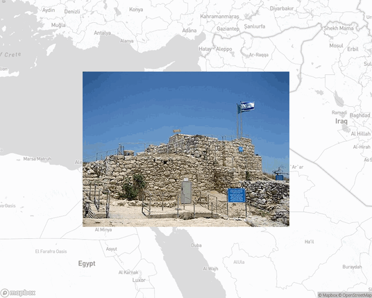 A photo of or from a national park from the linked website, overlaid on a cropped world map where it's located.