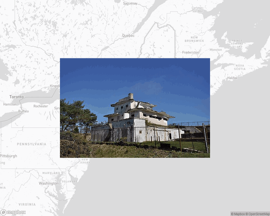 A photo of or from a park from the linked website, overlaid on a cropped world map where it's located.