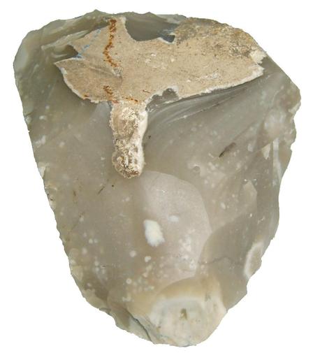 A piece of flint - a greeny grey mottled translucent rock