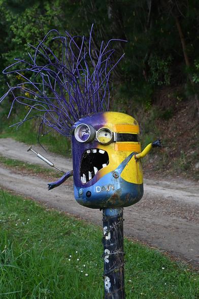 A photo of a metal lettbox shaped like a Minion from the movie Despicable Me. On the right side it's a regular yellow minion, and on the left side it's an evil purple minion.

My full-resolution photo is on Flickr at https://www.flickr.com/photos/mollivan_jon/54834359776/