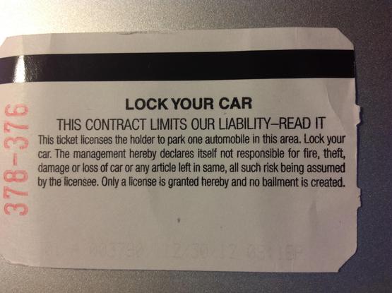 Terms on the back of a parking garage ticket.