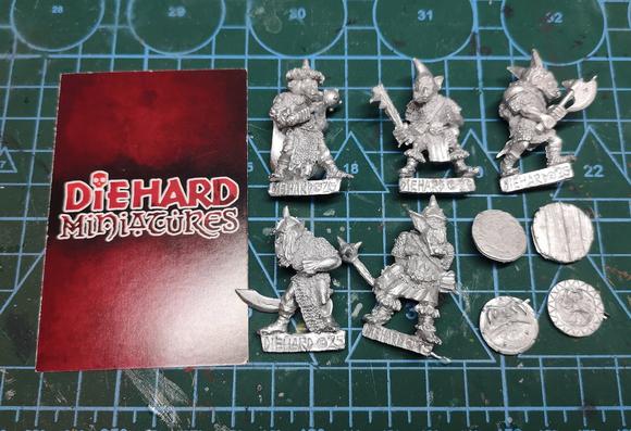 A unit of 5 metal orc miniatures prior to painting