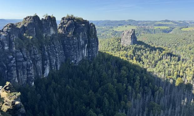 View over rocky outcrops set among forest