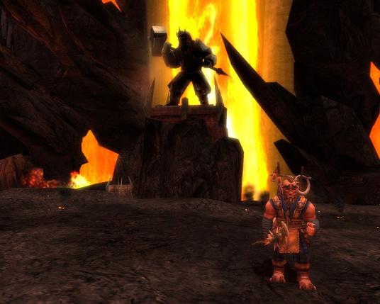 A lava fall in the background, a dwarven statue before it wielding a hammer. An NPC dwarf in the foreground.