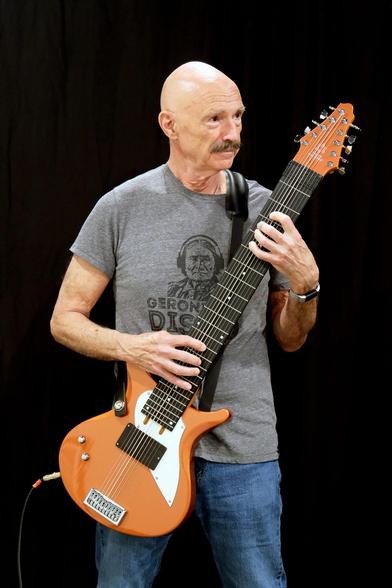 Baldy moustache bass genius Tony Levin