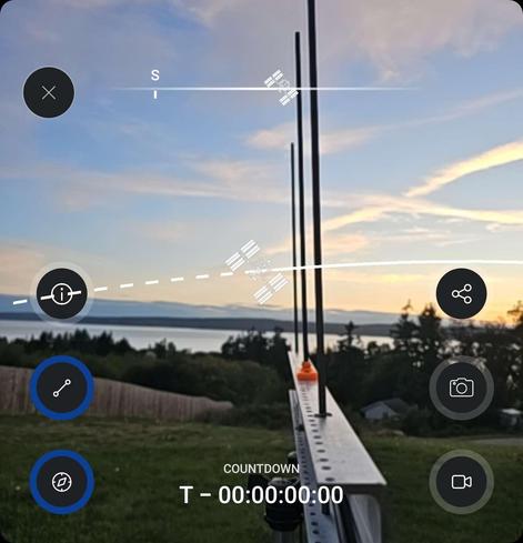 Picture taken from Spot The Station app showing a yagi antenna pointed at an AR (augmented reality) representation of the space station and it's current bearing/location.