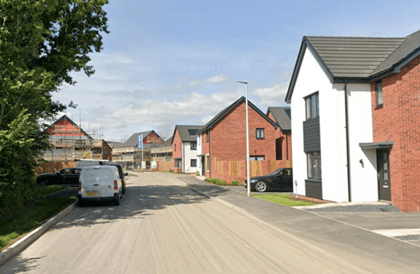 Screenshot of Persimmon’s Garden Village housing development in Swansea, a 700‑home scheme with school and community facilities now under construction.