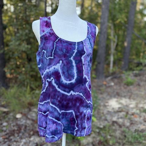 The front of an ice dyed tank top in shades of purple