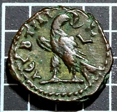 284 Rome Numerian Tetradrachm - Reverse:  Eagle standing left, head right with wreath in its beak. Lettering: ΛEΓ B TΡAI - LΓ