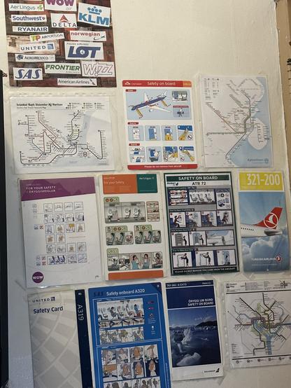 various airplane safety cards taped to my bedroom wall at my old place