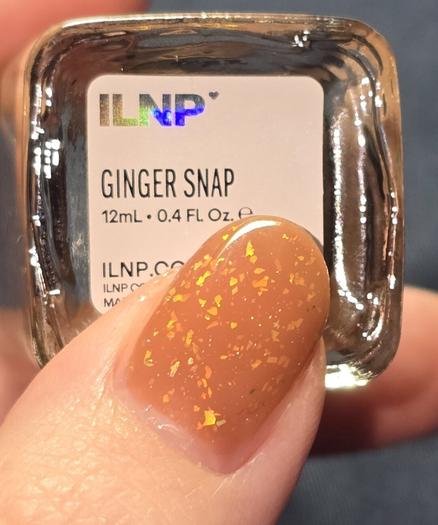 My thumb on the label of the nail polish bottle