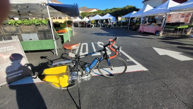 Bicycle in front of farm stands