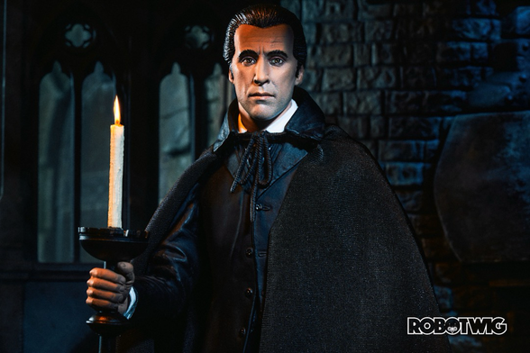 Dracula holds a candle looking directly at the camera. Setting is an old castle at night